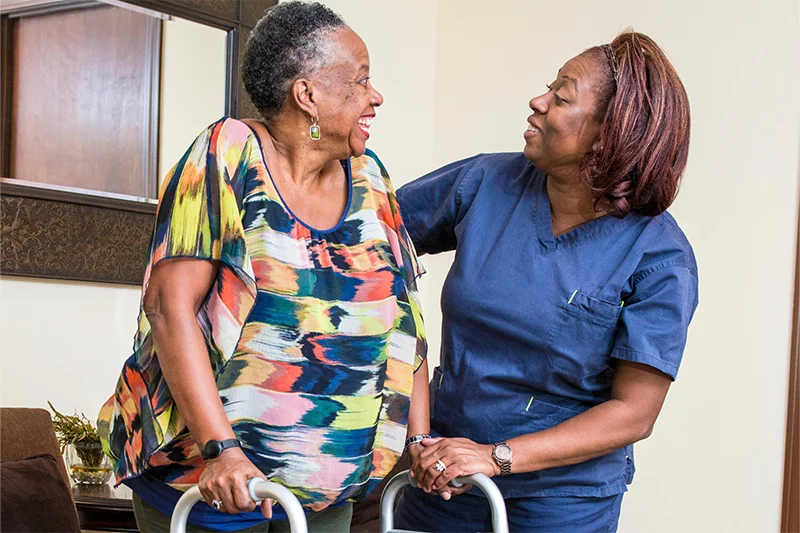 client-with-walker-smiling